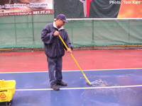 Enrique mops the tennis courts