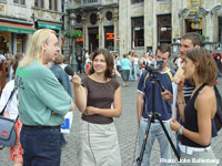Rick Wakeman speaks with students working on a project, in Belgium